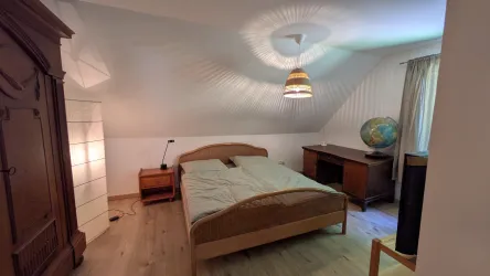 Schlafzimmer mit Schreibtisch